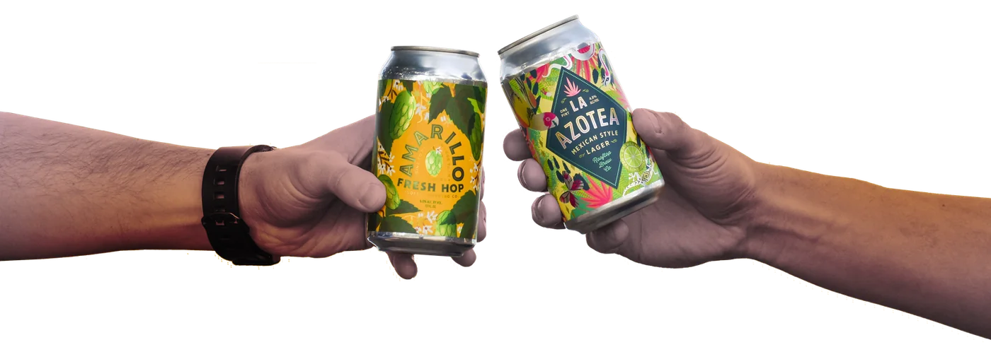 Two cans of Rooftop beer clinking